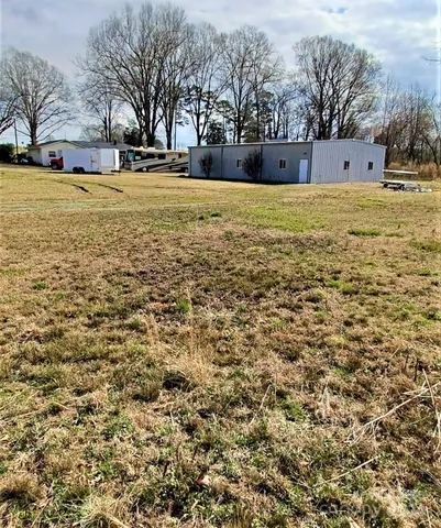 a view of a park with large trees