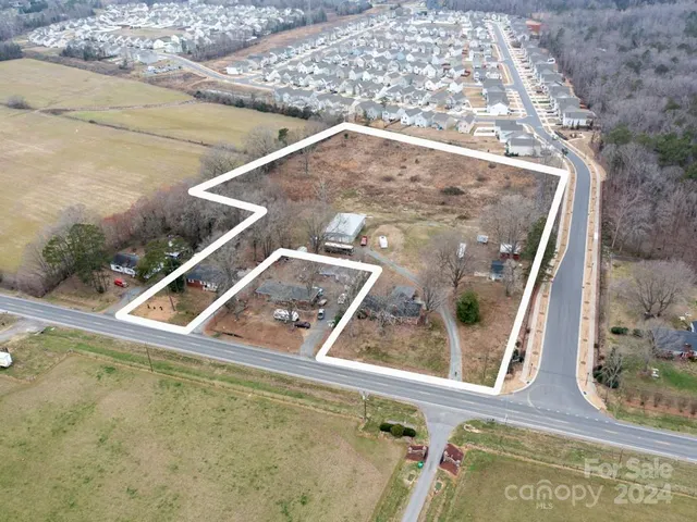 a view of street with parked cars