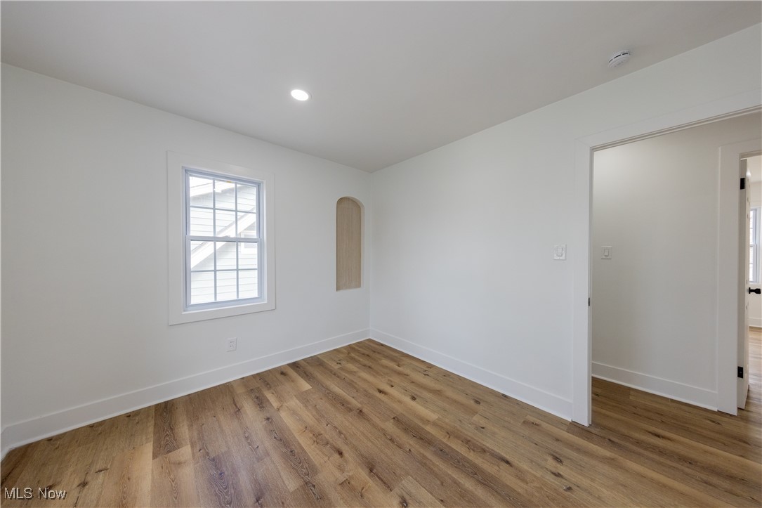 3694 Chelton Road Cleveland, OH 44120 - Photo 23 of 33 Spare room featuring recessed lighting, baseboards, and wood finished floors