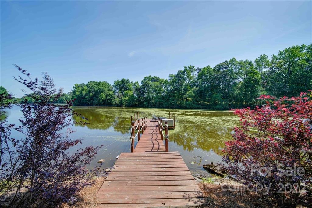 3617 Lake Twitty Drive Monroe, NC 28110 - Photo 17 of 47 a view of a lake with a yard