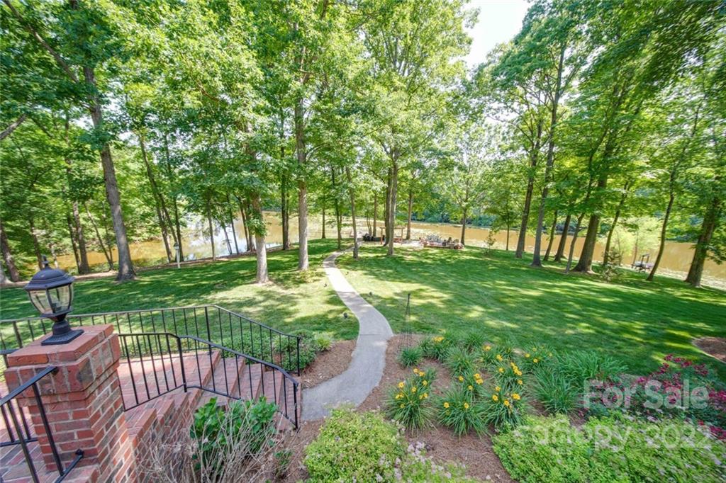 3617 Lake Twitty Drive Monroe, NC 28110 - Photo 18 of 47 a view of a garden with a bench