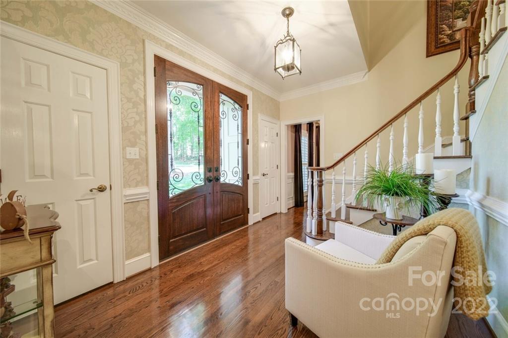 3617 Lake Twitty Drive Monroe, NC 28110 - Photo 20 of 47 a living room with furniture and a chandelier