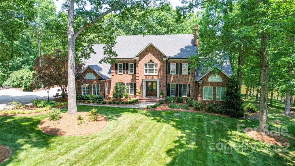 3617 Lake Twitty Drive Monroe, NC 28110 - Photo 3 of 47 a view of a white house with a big yard and large trees