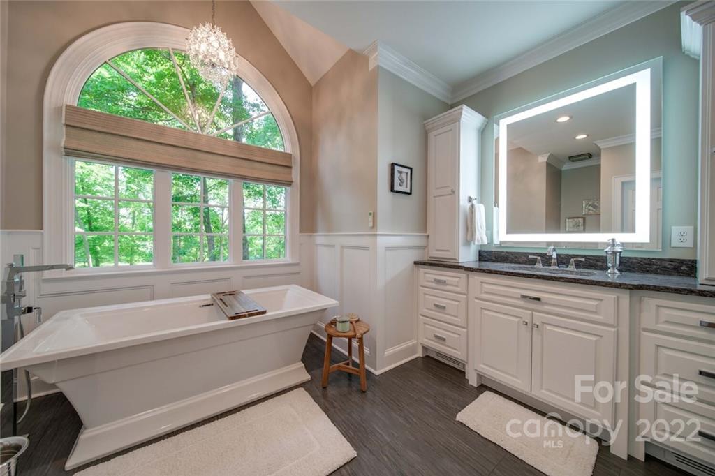 3617 Lake Twitty Drive Monroe, NC 28110 - Photo 36 of 47 a bathroom with a granite countertop sink mirror and a large window