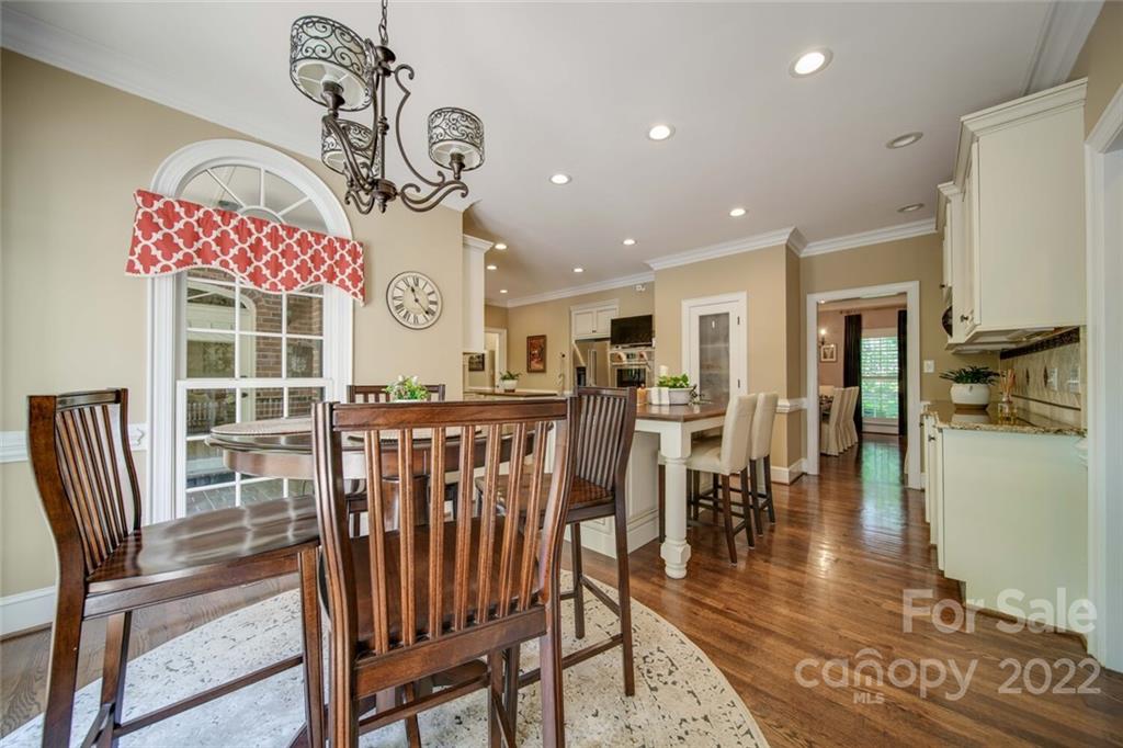 3617 Lake Twitty Drive Monroe, NC 28110 - Photo 37 of 47 a view of a dining room with furniture a chandelier and wooden floor