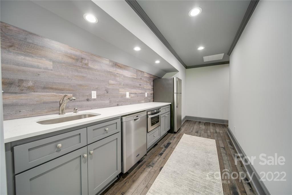 3617 Lake Twitty Drive Monroe, NC 28110 - Photo 43 of 47 a large white kitchen with a sink and dishwasher
