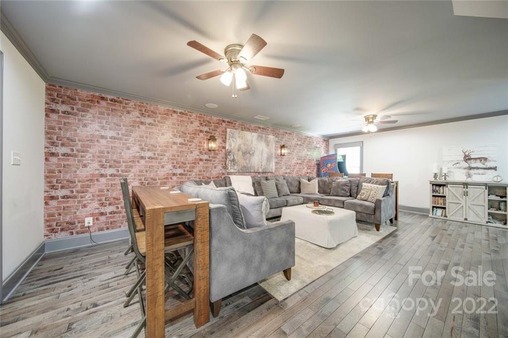 3617 Lake Twitty Drive Monroe, NC 28110 - Photo 45 of 47 a living room with fireplace furniture and a wooden floor