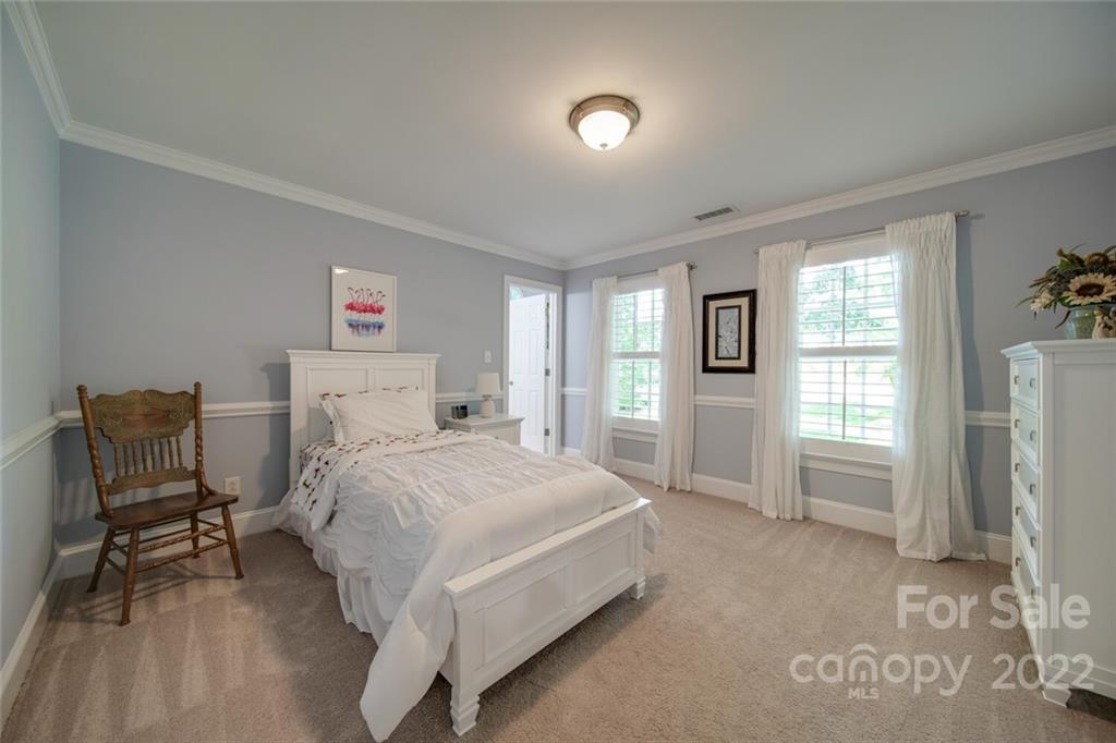 3617 Lake Twitty Drive Monroe, NC 28110 - Photo 46 of 47 a bedroom with a bed and a chair in it