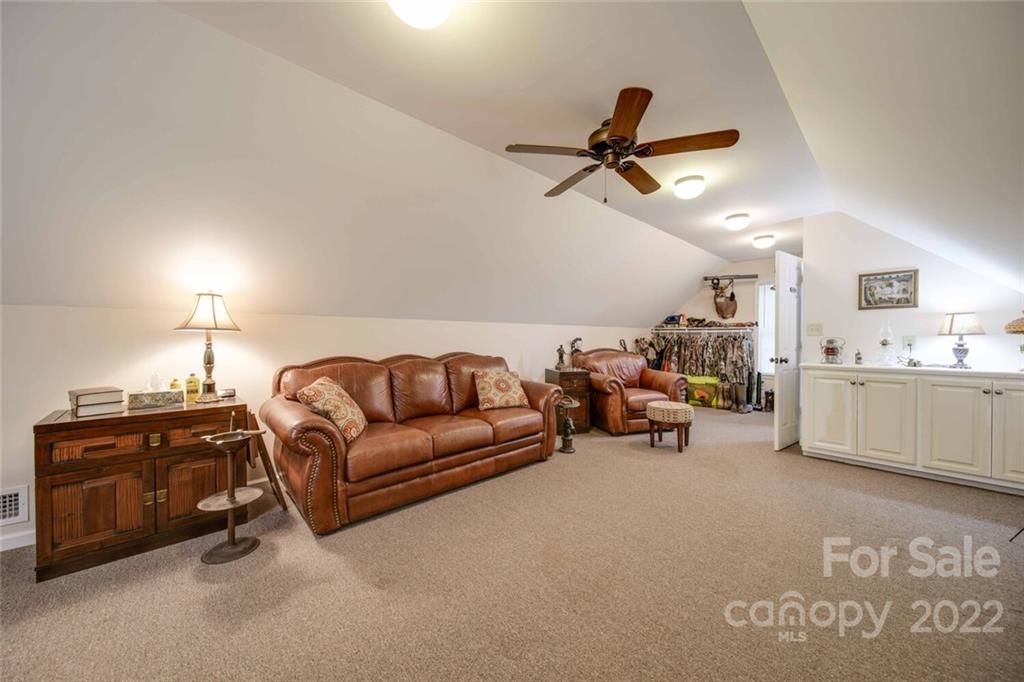3617 Lake Twitty Drive Monroe, NC 28110 - Photo 47 of 47 a living room with furniture and a kitchen view