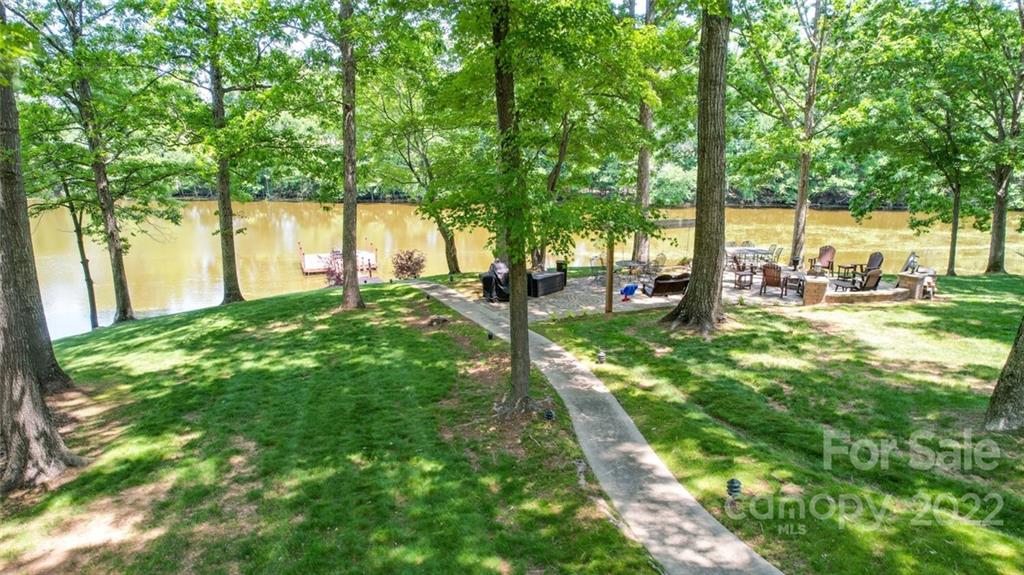 3617 Lake Twitty Drive Monroe, NC 28110 - Photo 8 of 47 a view of yard with green space and trees