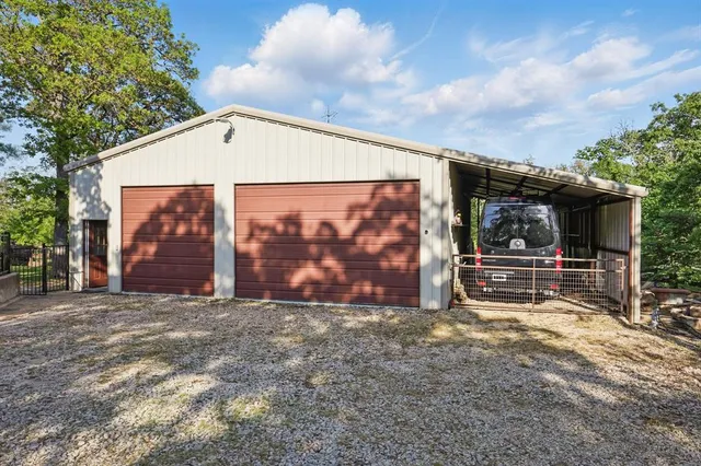 a view of a garage with wooden shelves