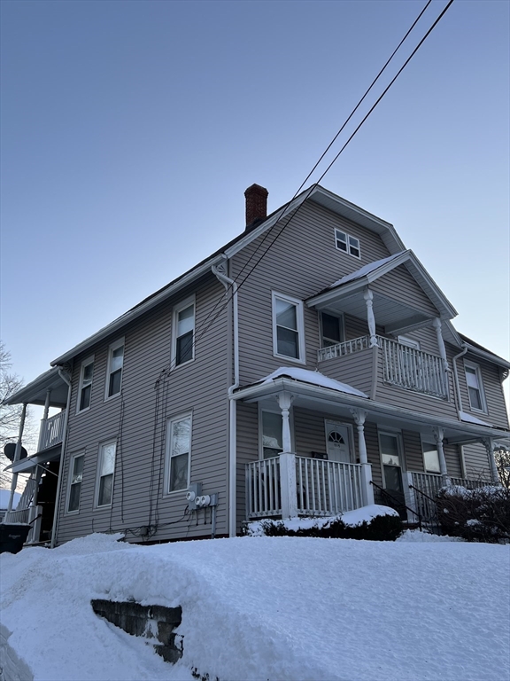 315 Main Street, Unit 1 Springfield, MA 01151 - Photo 1 of 10 a front view of a house with a yard