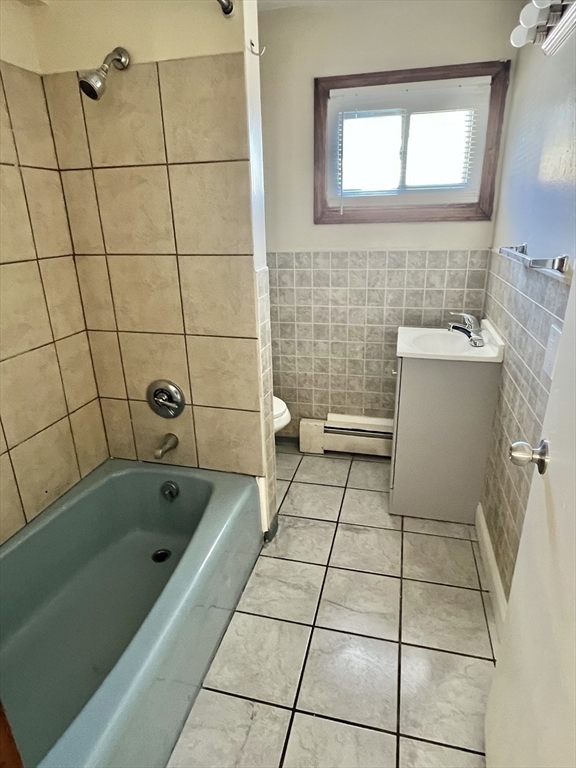 315 Main Street, Unit 1 Springfield, MA 01151 - Photo 9 of 10 a bathroom with a bathtub and a shower