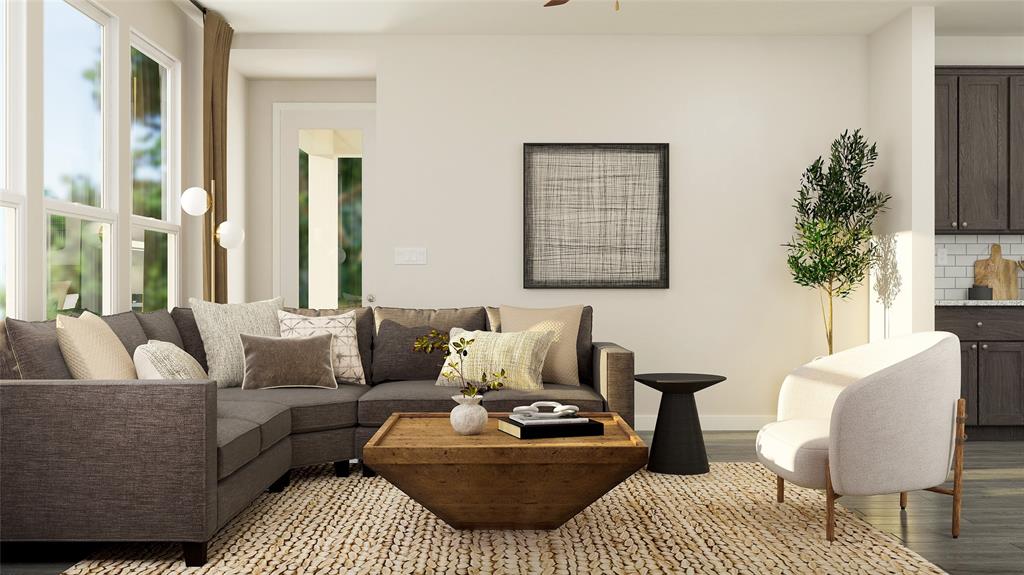 a living room with furniture and a potted plant