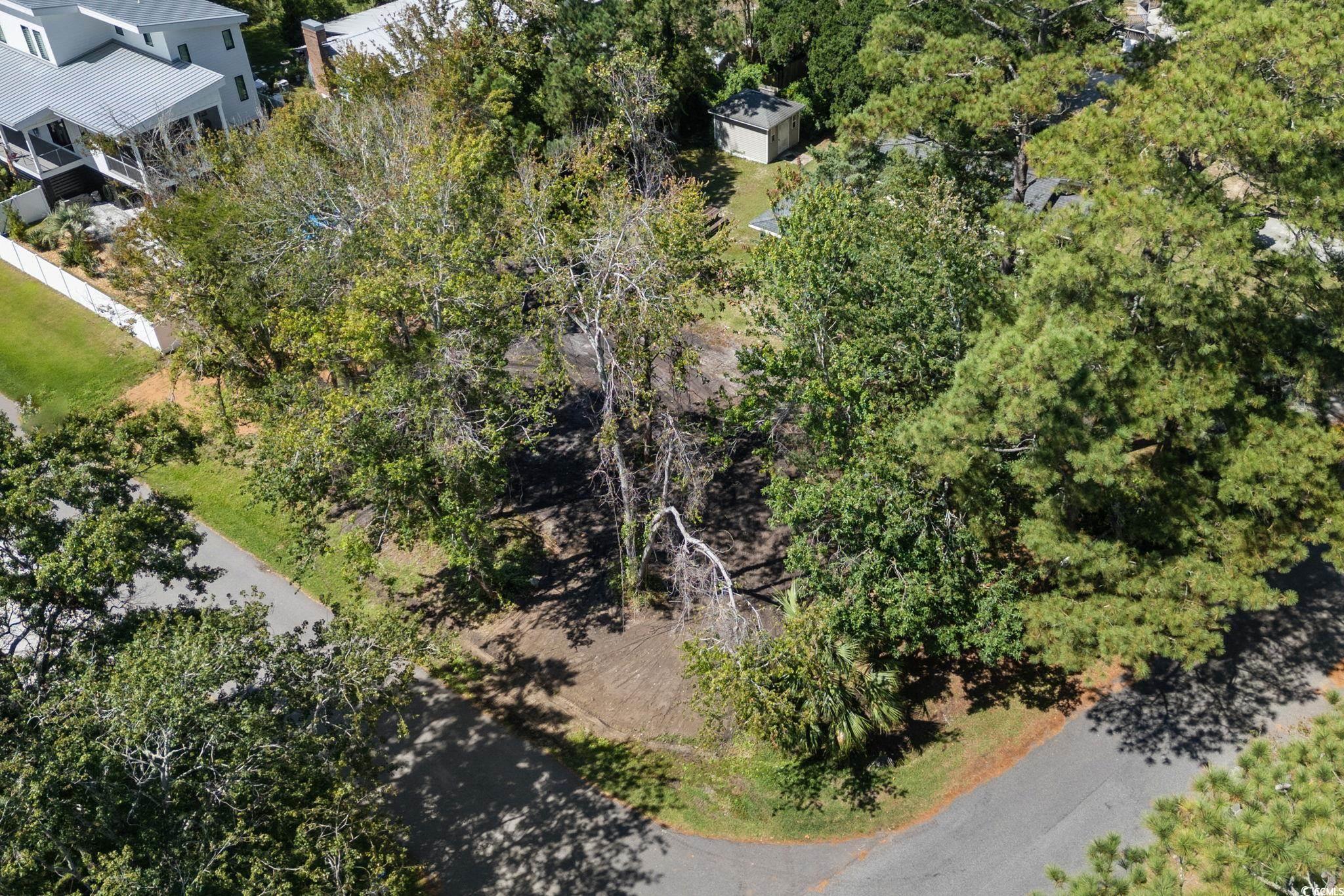 511 7th Avenue North Surfside Beach, SC 29575 - Photo 7 of 24 Drone / aerial view of a tree filled landscape