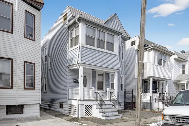 a front view of a house with street