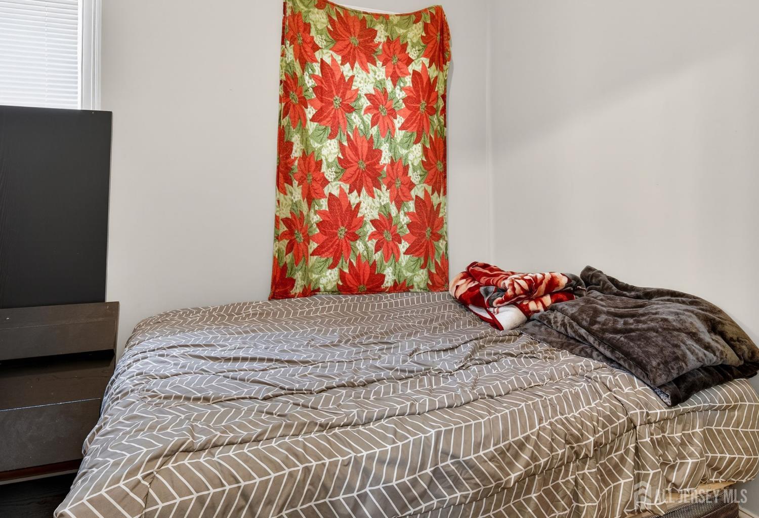 441 South Clinton Street East Orange, NJ 07018 - Photo 22 of 27 a bedroom with a bed and a couch