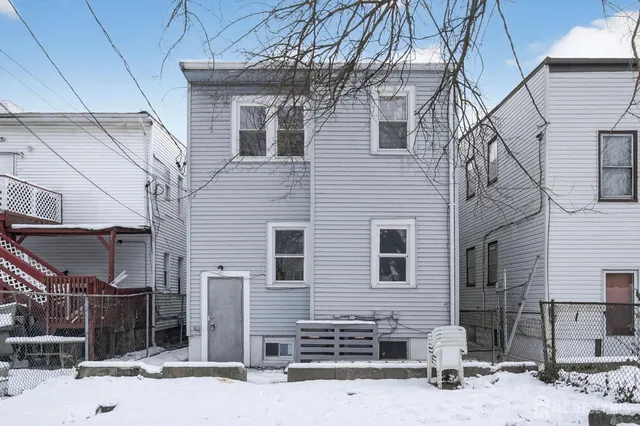 a front view of a house with parking space