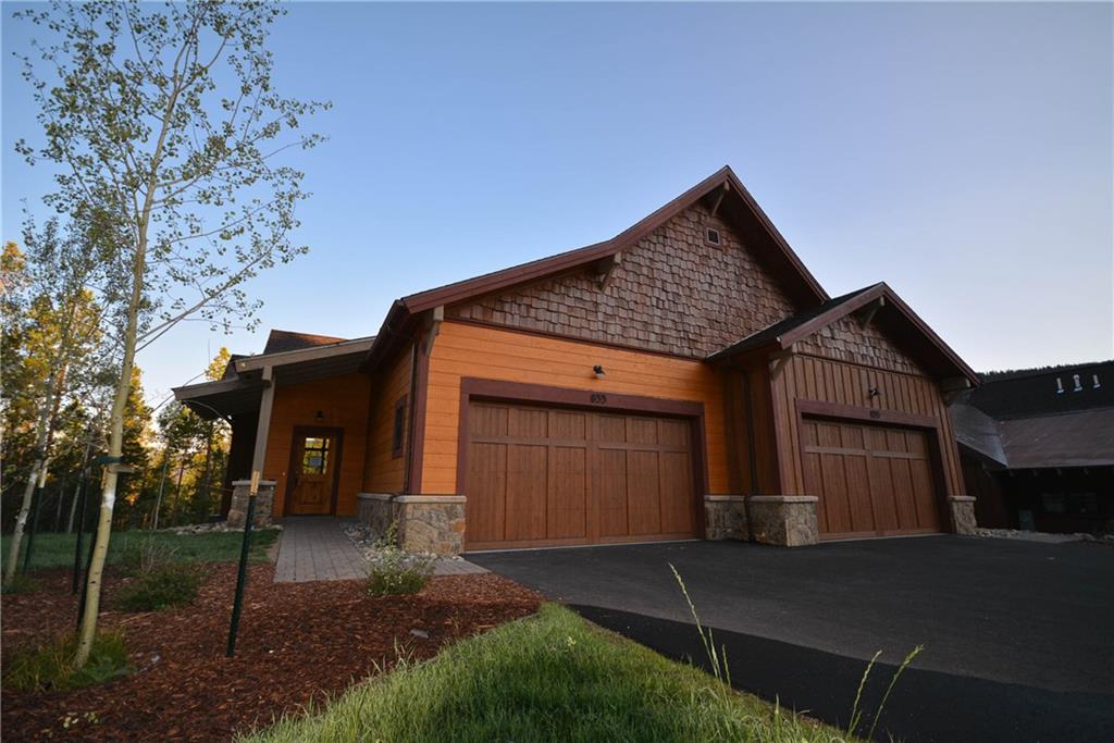 876 Independence Road, Unit 1B Keystone, CO 80435 - Photo 23 of 25 a front view of a house with garden