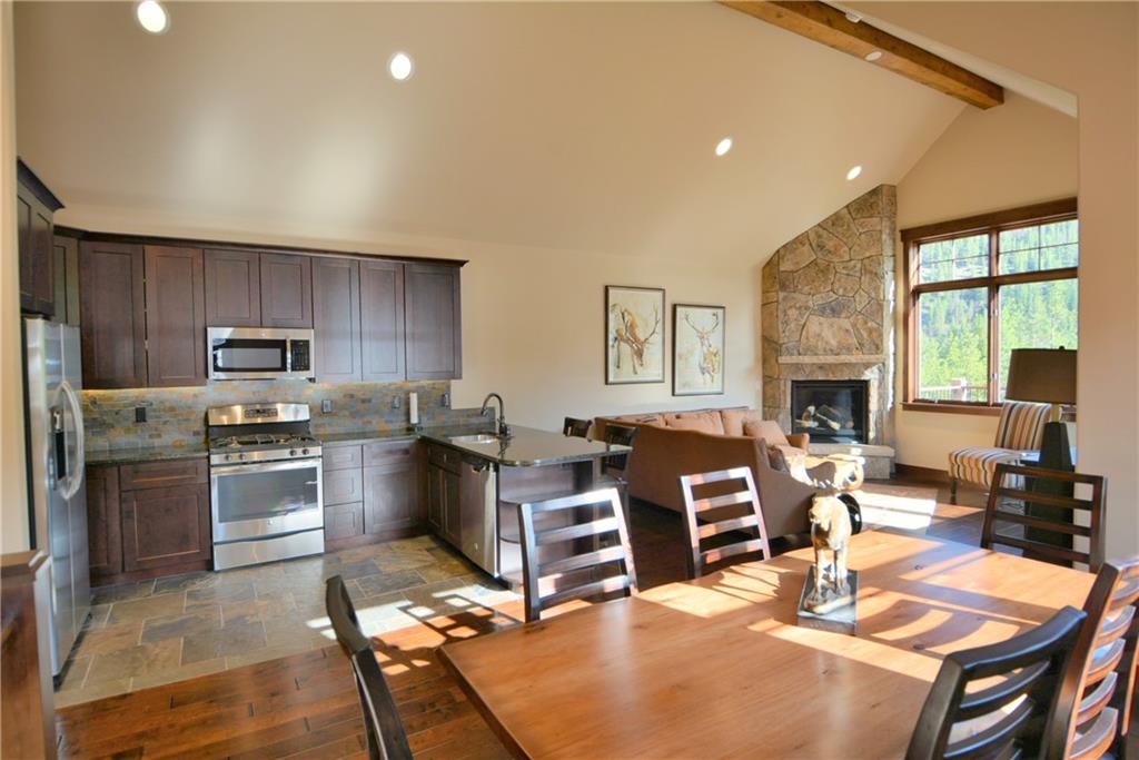 876 Independence Road, Unit 1B Keystone, CO 80435 - Photo 5 of 25 a living room with furniture a large window and kitchen view