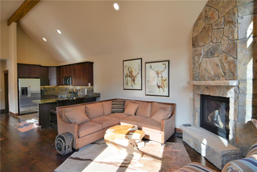 876 Independence Road, Unit 1B Keystone, CO 80435 - Photo 6 of 25 a living room with furniture and a fireplace
