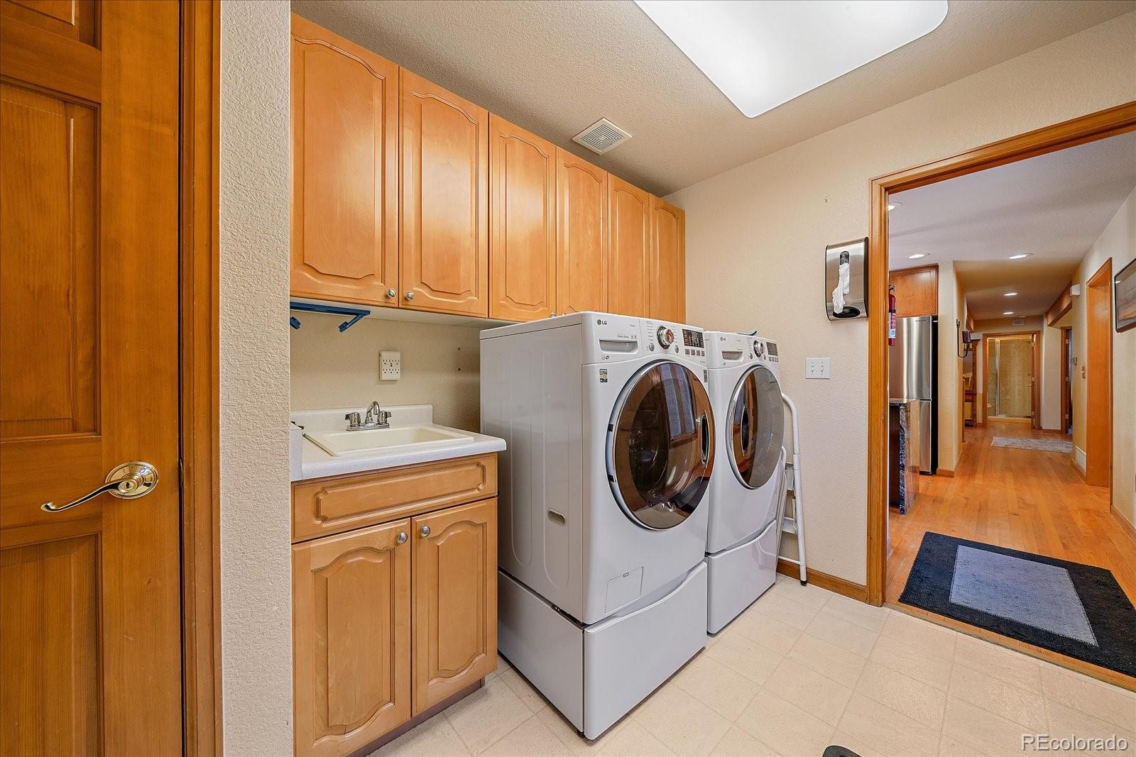9948 South Turkey Creek Road Conifer, CO 80433 - Photo 19 of 50 a utility room with dryer and washer