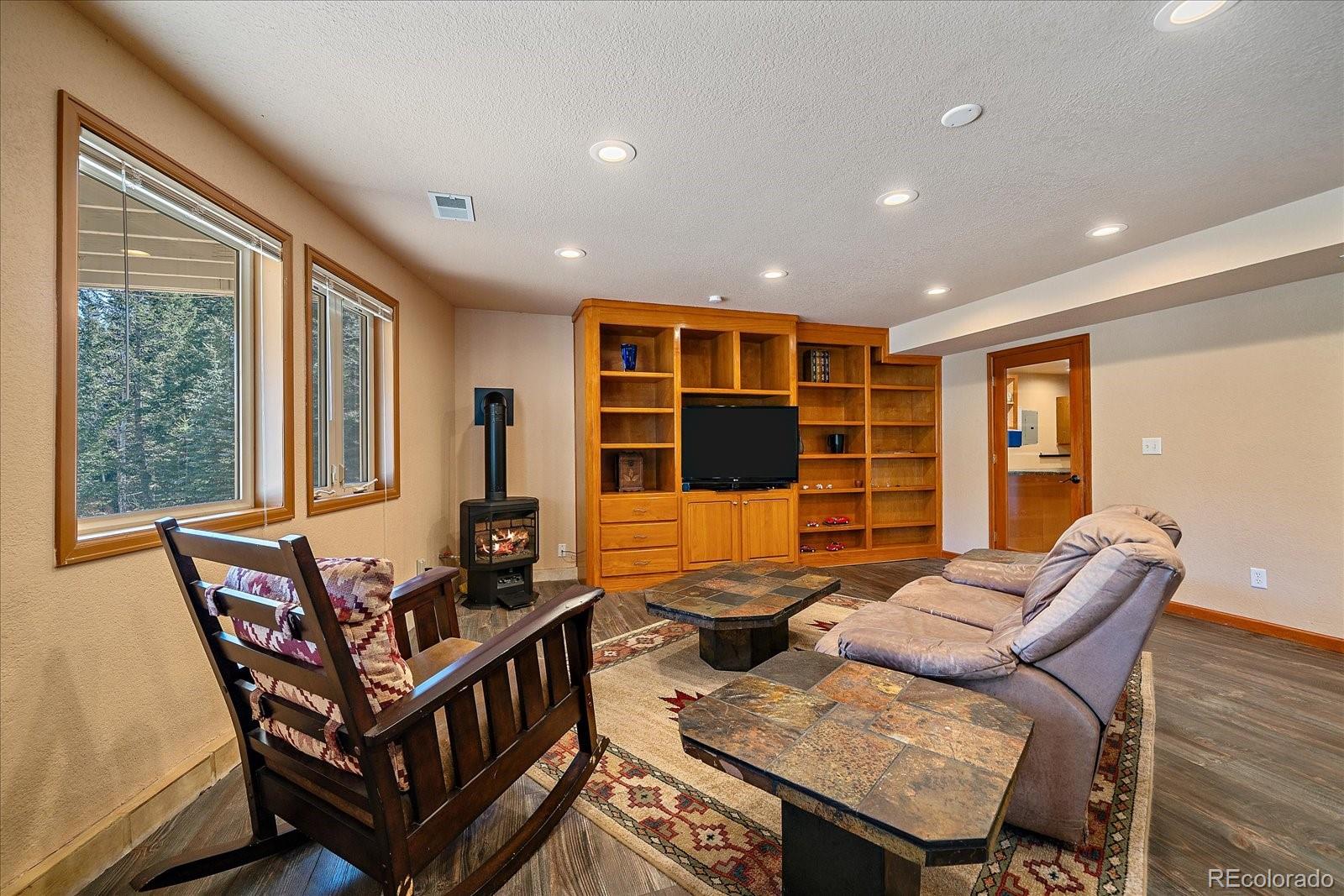 9948 South Turkey Creek Road Conifer, CO 80433 - Photo 38 of 50 a living room with furniture and a window