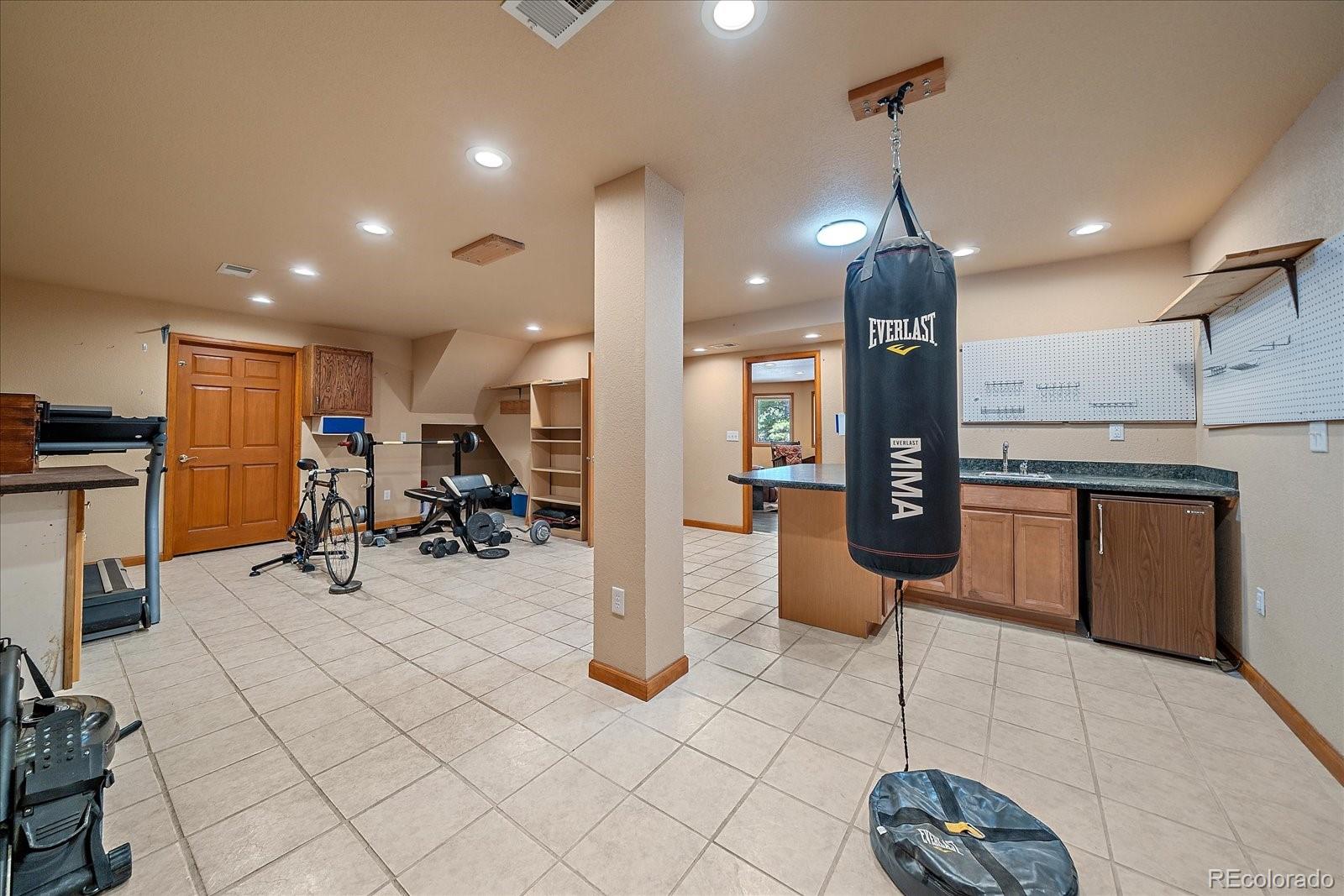 9948 South Turkey Creek Road Conifer, CO 80433 - Photo 39 of 50 a view of a kitchen with stainless steel appliances kitchen island granite countertop dining table chairs and a large window