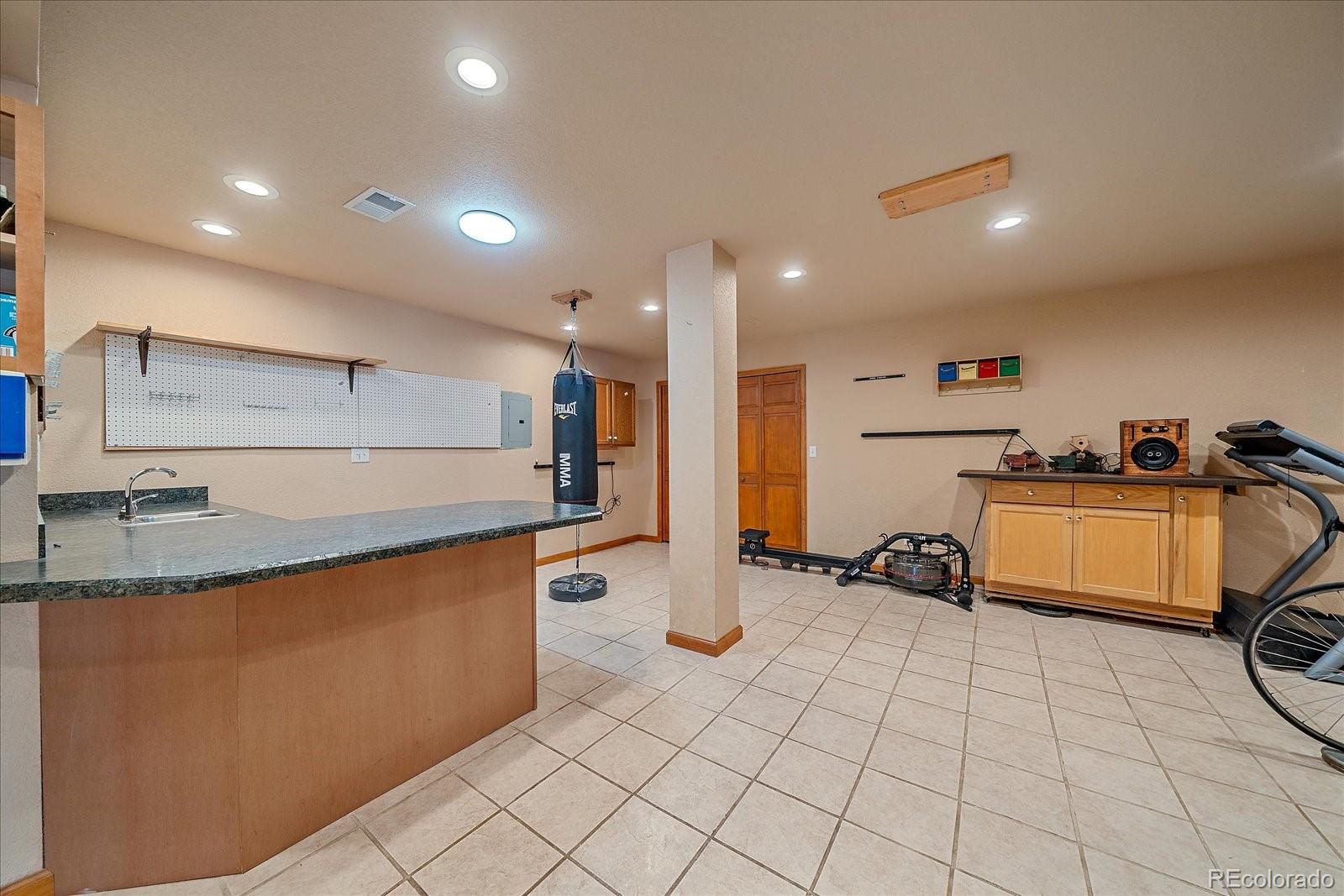 9948 South Turkey Creek Road Conifer, CO 80433 - Photo 40 of 50 a kitchen with stainless steel appliances a sink a stove a refrigerator and cabinets
