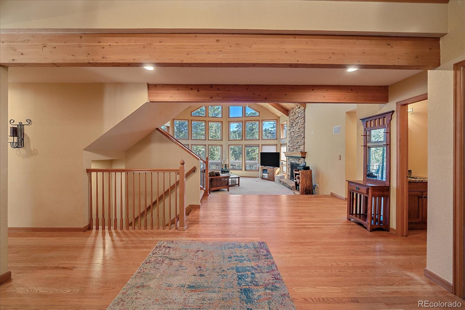9948 South Turkey Creek Road Conifer, CO 80433 - Photo 8 of 50 a view of a livingroom with furniture and stairs