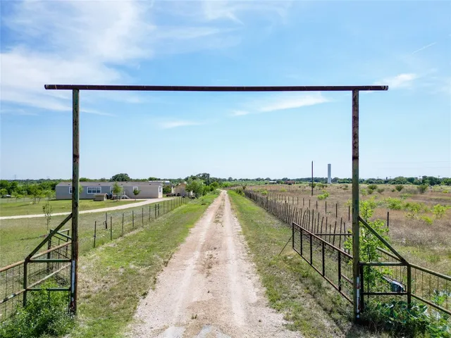 a view of a lake with a yard