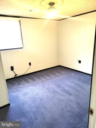 a room with gym equipment and a window