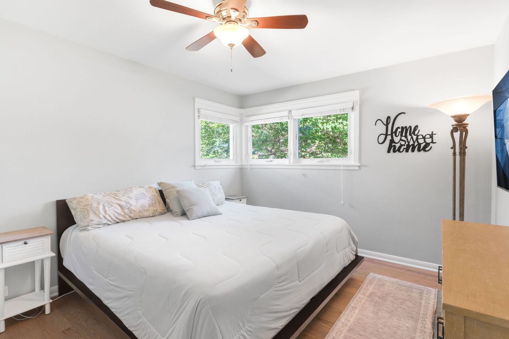 640 South Grove Avenue Barrington, IL 60010 - Photo 11 of 24 a bedroom with a large bed and a chandelier