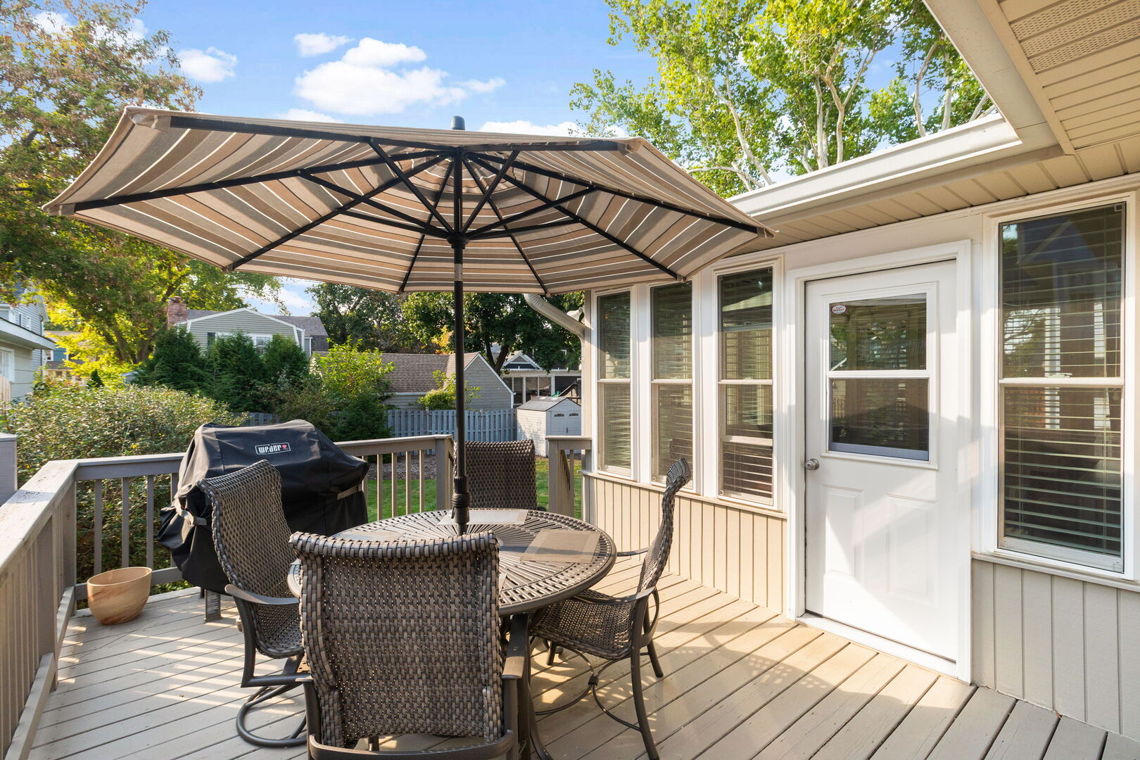 640 South Grove Avenue Barrington, IL 60010 - Photo 18 of 24 a patio with wooden floor a yard a table and chairs