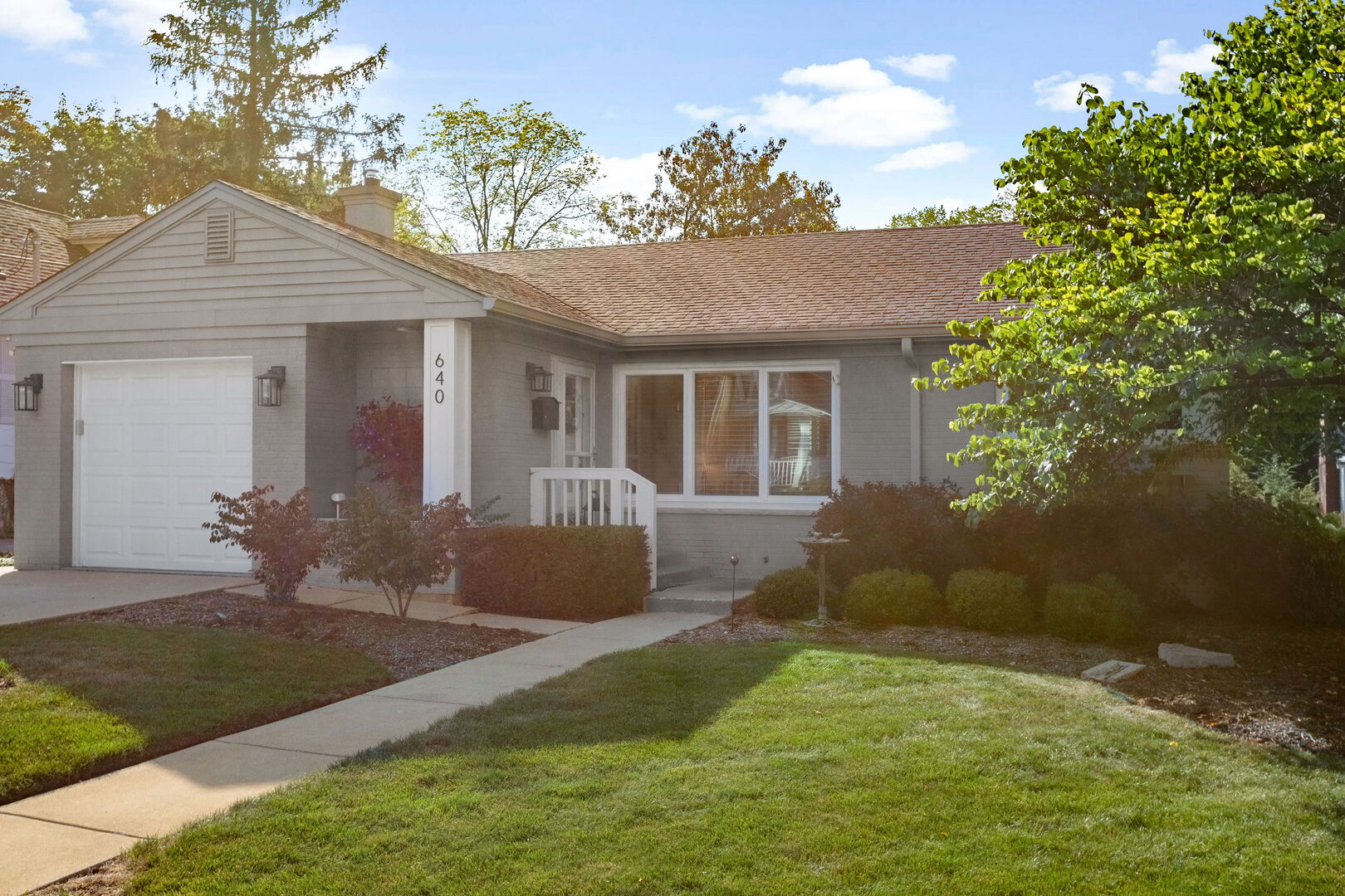640 South Grove Avenue Barrington, IL 60010 - Photo 2 of 24 a house view with a garden space