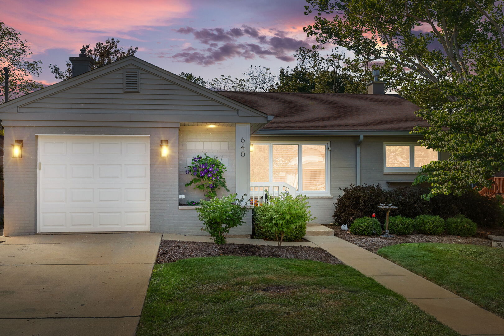640 South Grove Avenue Barrington, IL 60010 - Photo 21 of 24 a front view of a house with a garden