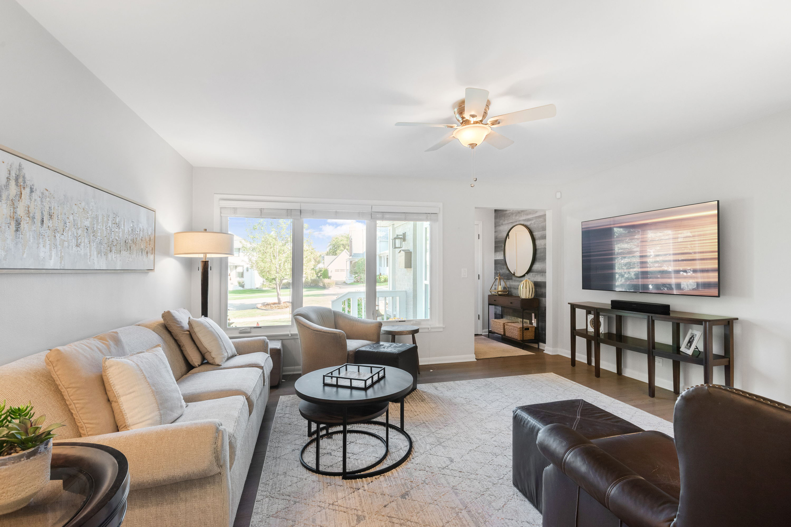 640 South Grove Avenue Barrington, IL 60010 - Photo 4 of 24 a living room with furniture a fireplace and a large window