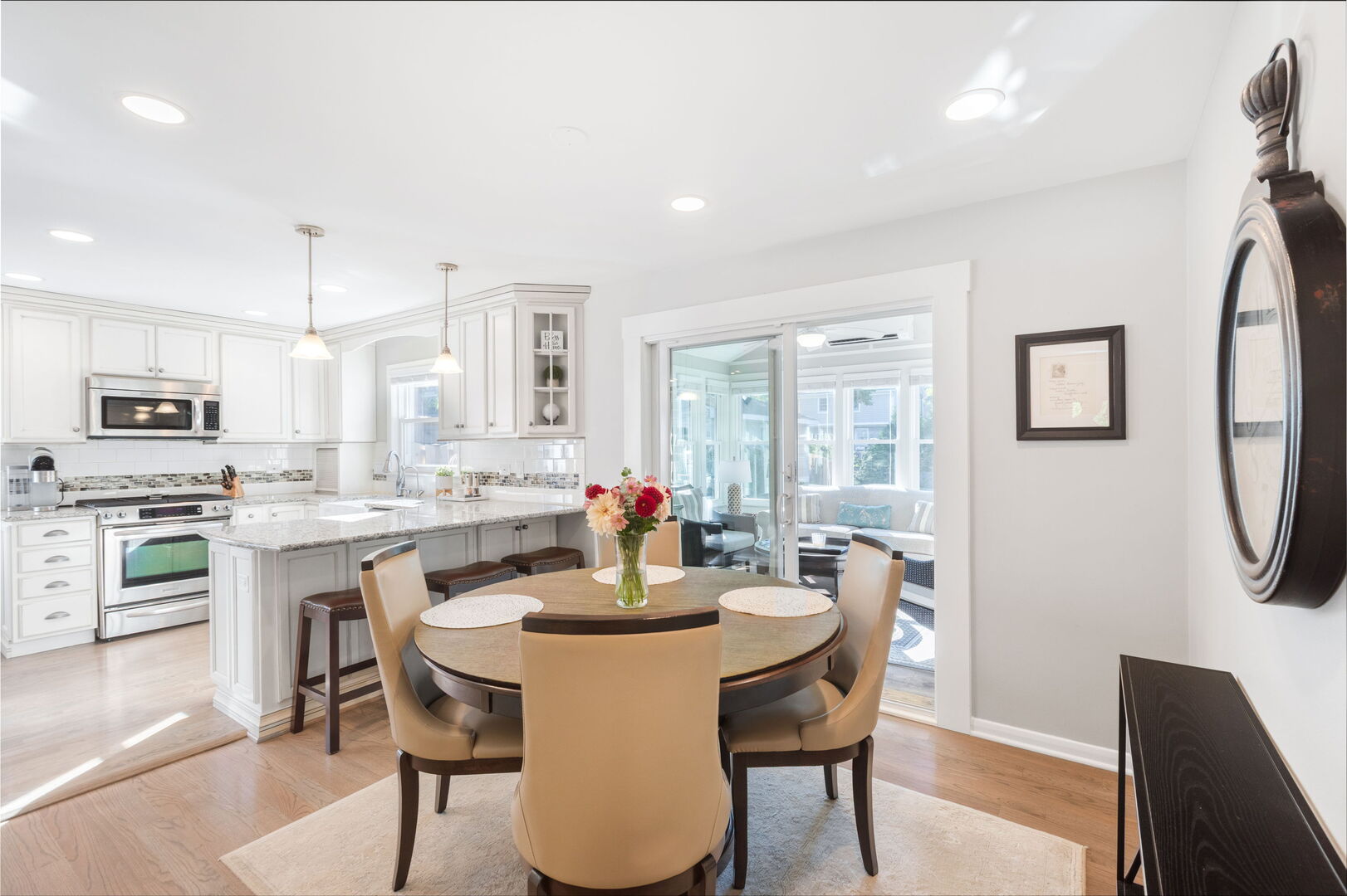 640 South Grove Avenue Barrington, IL 60010 - Photo 5 of 24 a kitchen with a dining table chairs and refrigerator