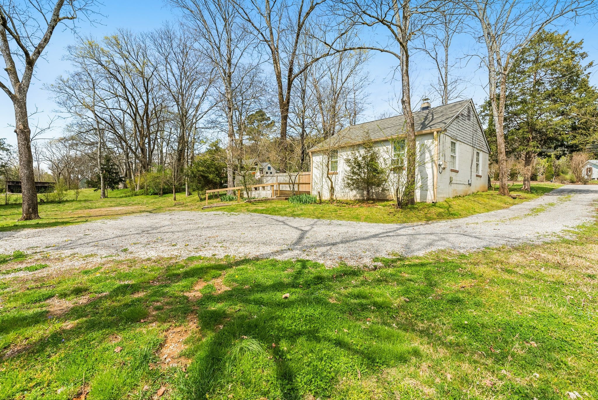 4259 Old Hillsboro Road Franklin, TN 37064 - Photo 8 of 11 a building with trees in front of it