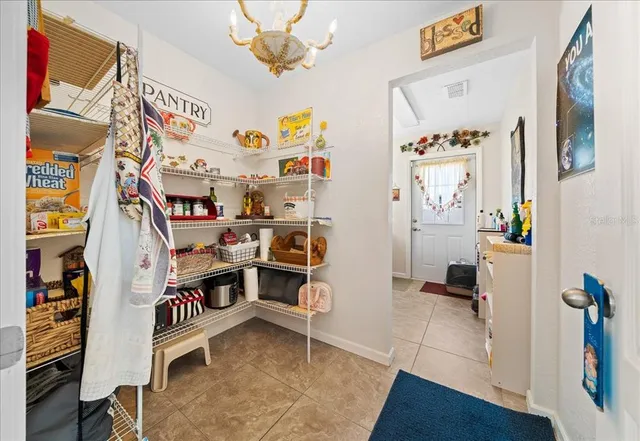 a spacious bathroom with a double vanity sink and a mirror
