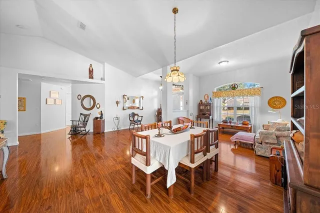 a view of a living room and dining room