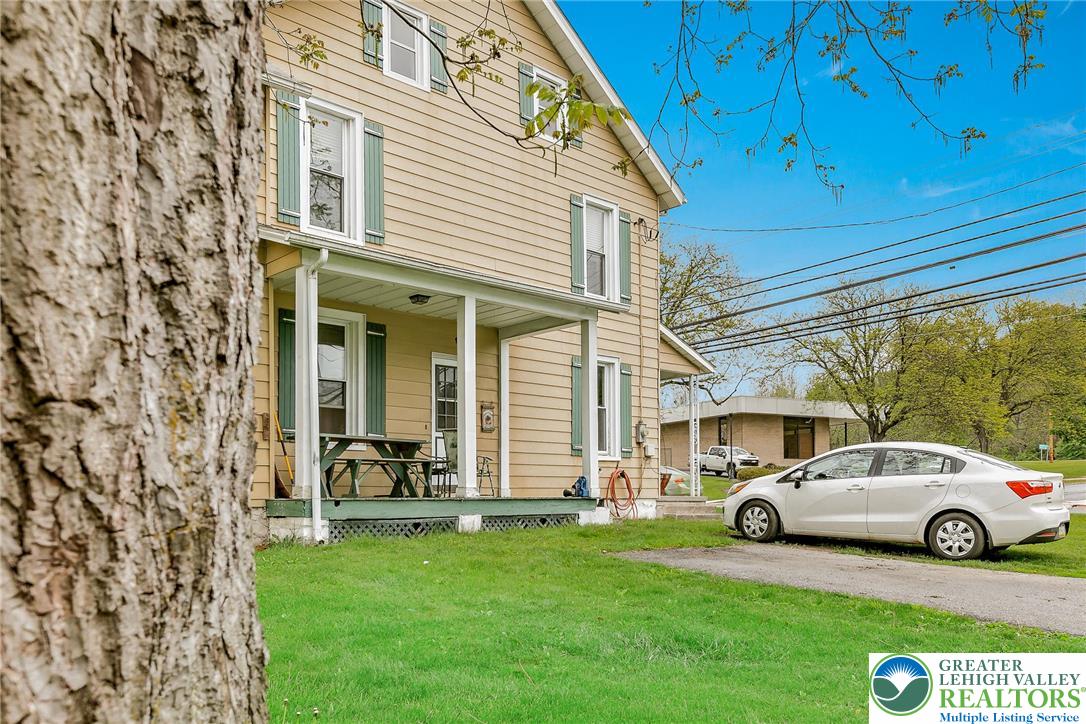174 North Chestnut Street Bath, PA 18014 - Photo 20 of 20 a view of a car parked in front of a house with a big yard