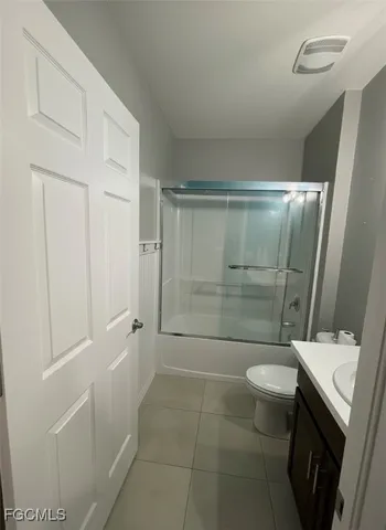 a bathroom with a shower and toilet