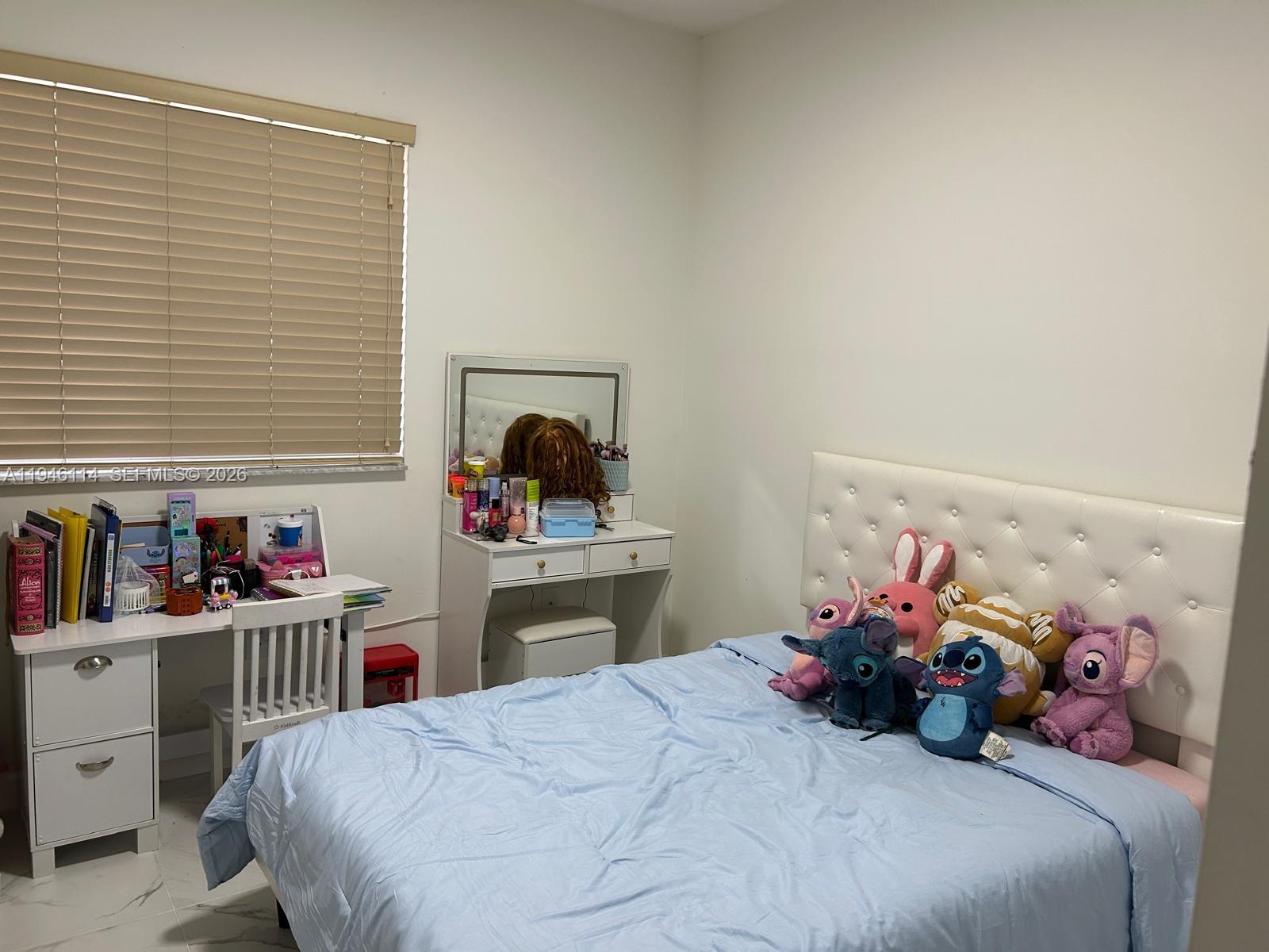 22844 Southwest 114th Avenue Miami, FL 33170 - Photo 18 of 40 a bedroom with a bed and closet