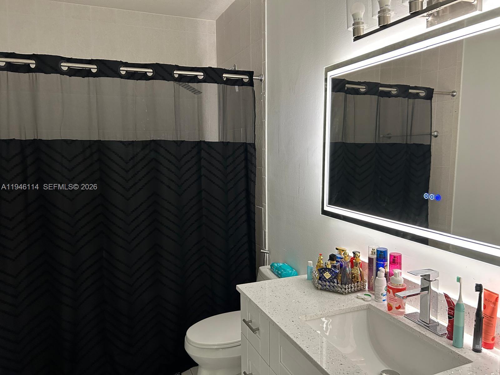 22844 Southwest 114th Avenue Miami, FL 33170 - Photo 24 of 40 a bathroom with a sink and a mirror