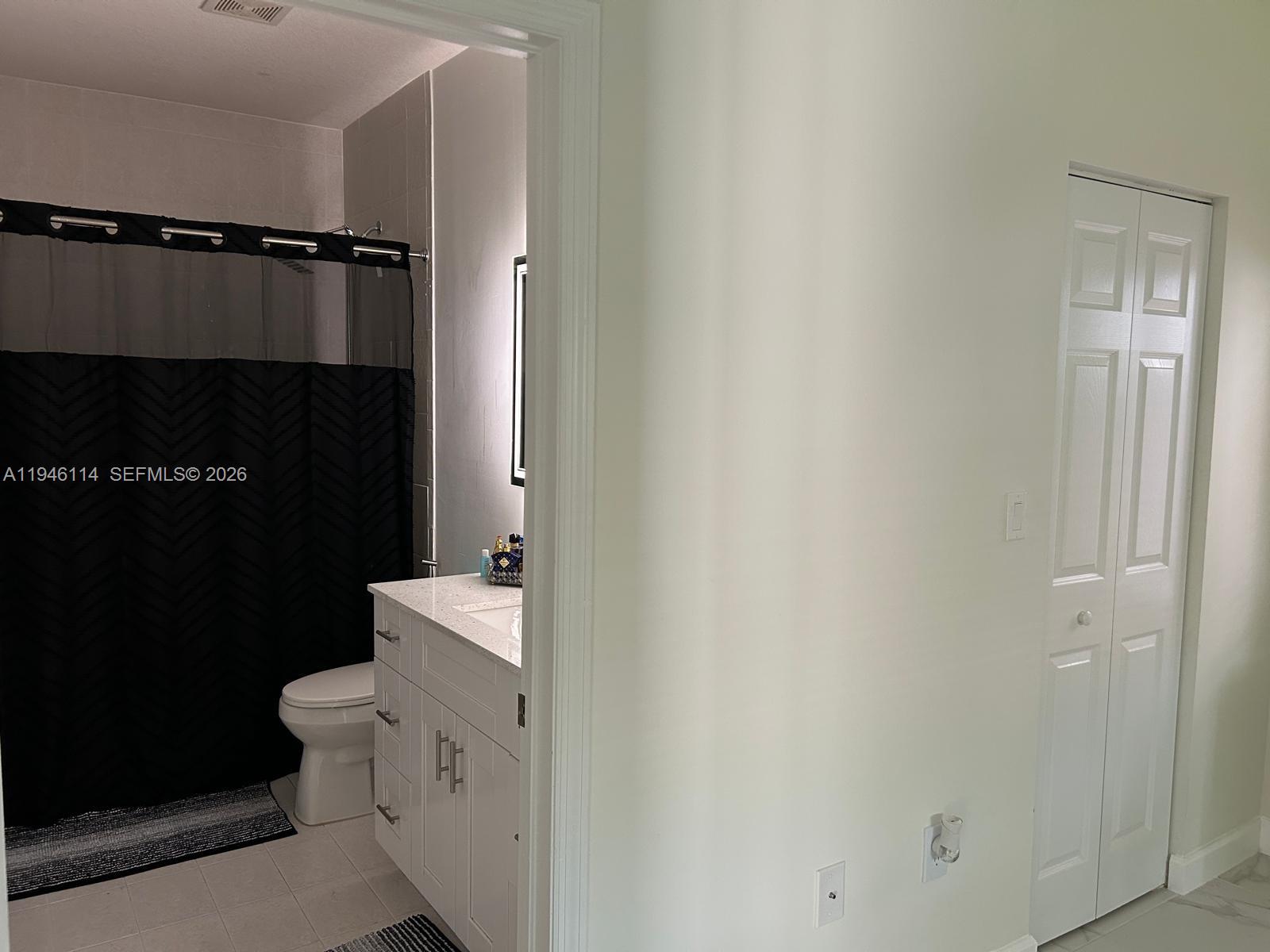 22844 Southwest 114th Avenue Miami, FL 33170 - Photo 25 of 40 a bathroom with a toilet a sink and a shower