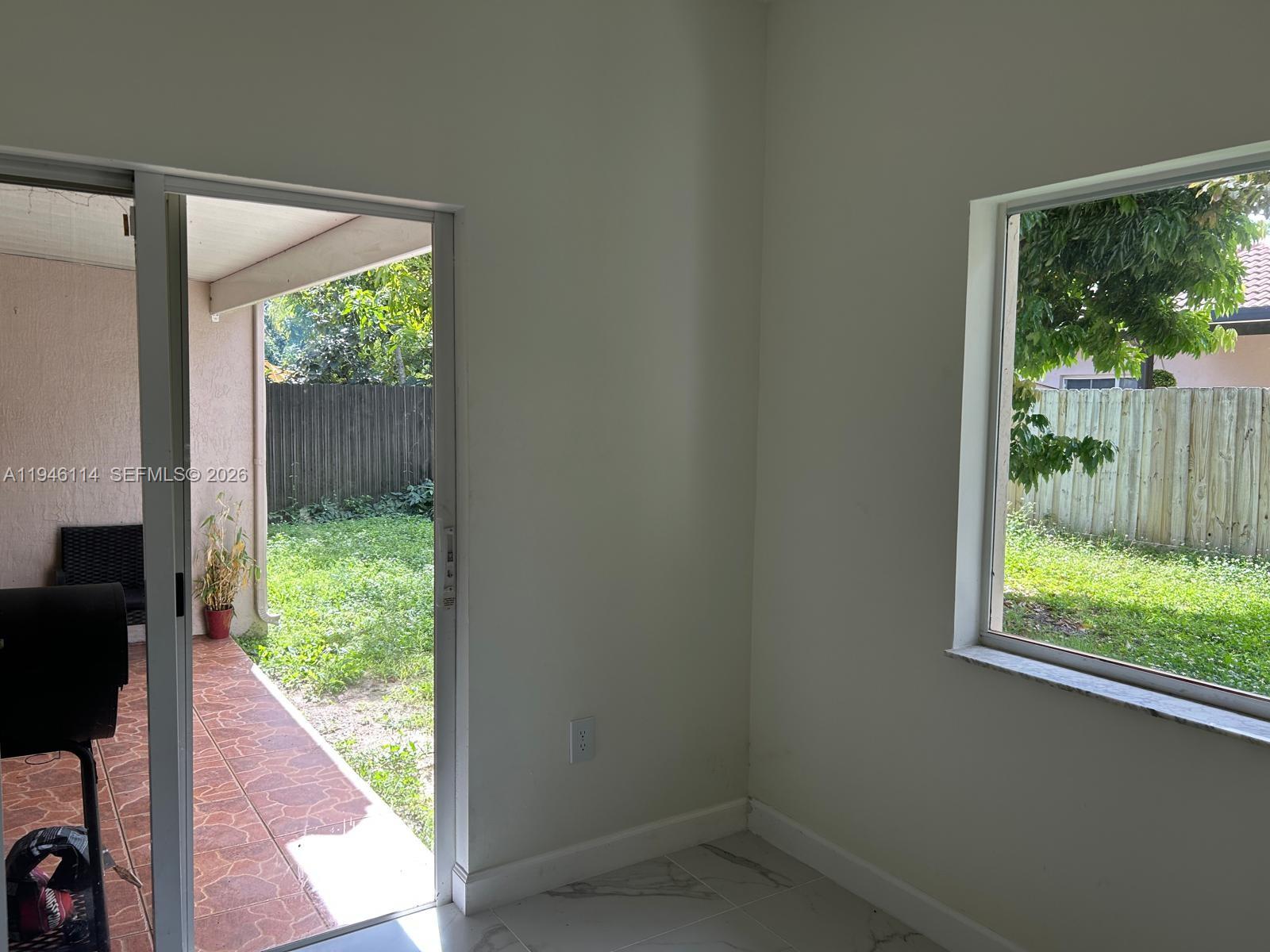 22844 Southwest 114th Avenue Miami, FL 33170 - Photo 32 of 40 a view of a back yard from a room