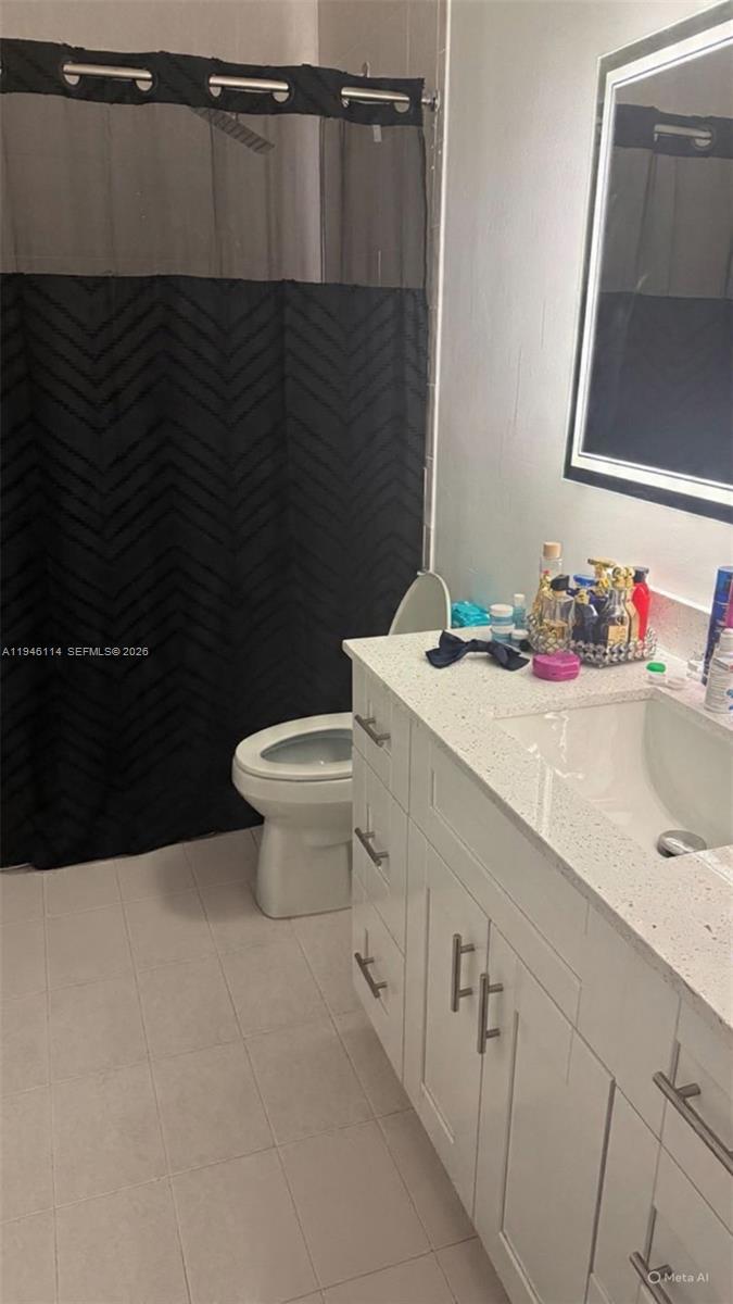 22844 Southwest 114th Avenue Miami, FL 33170 - Photo 7 of 40 a bathroom with a sink toilet and vanity