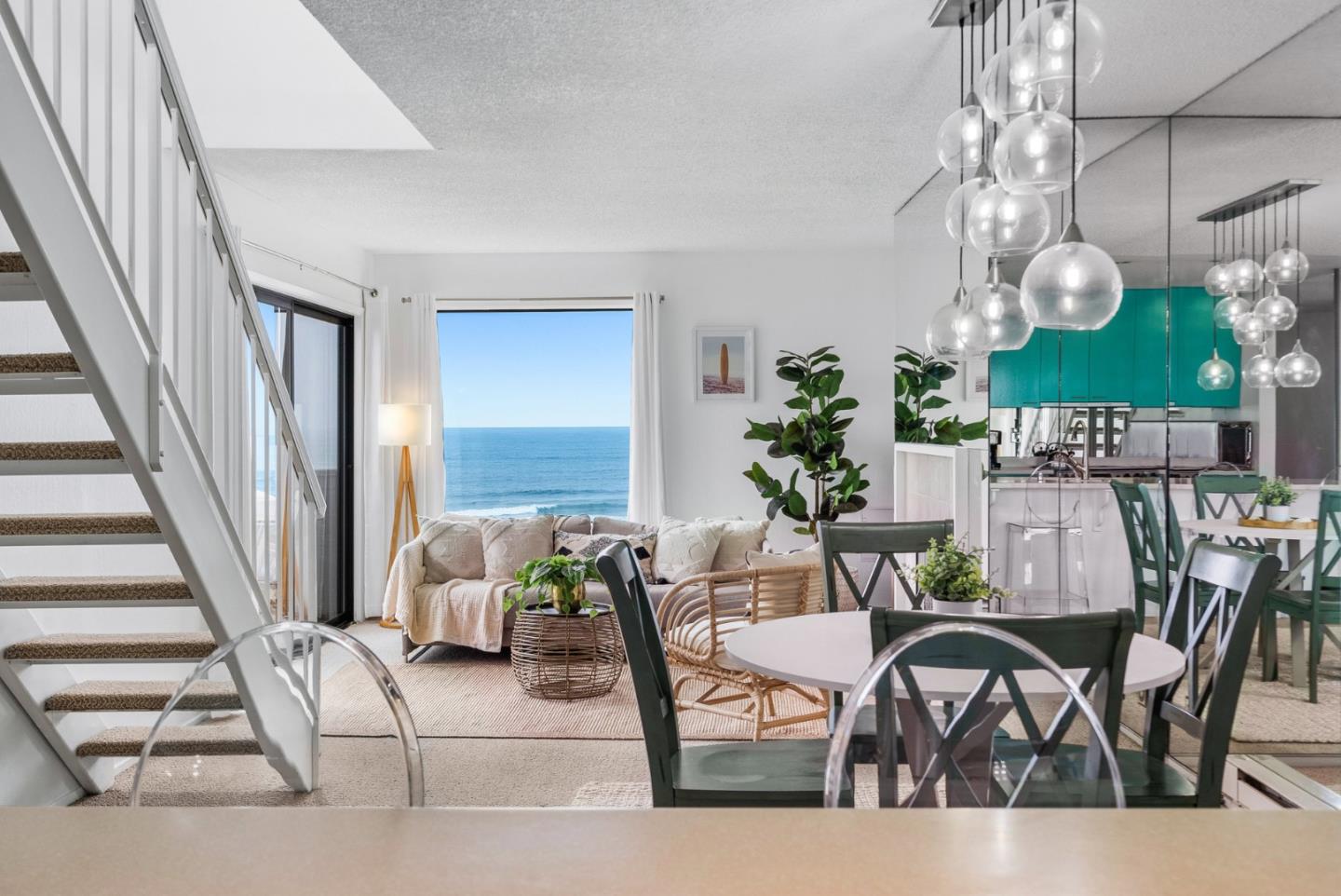101 Shell Road, Unit 32 Watsonville, CA 95076 - Photo 13 of 44 a view of a dining room with furniture and chandelier