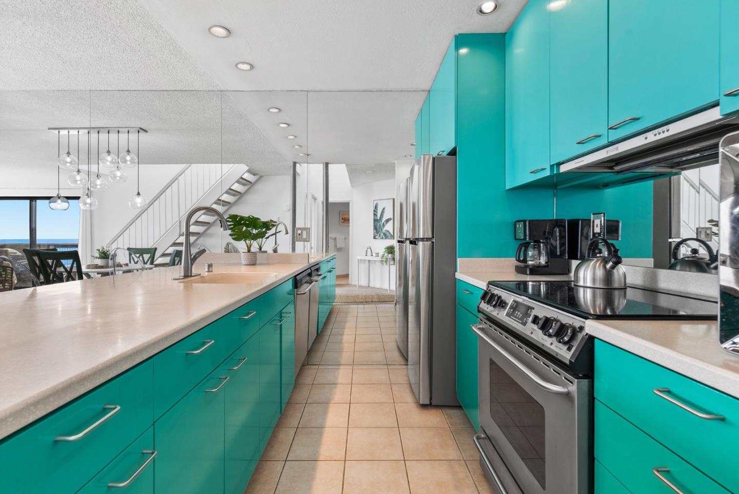 101 Shell Road, Unit 32 Watsonville, CA 95076 - Photo 19 of 44 a kitchen with stainless steel appliances granite countertop a sink a stove and a refrigerator